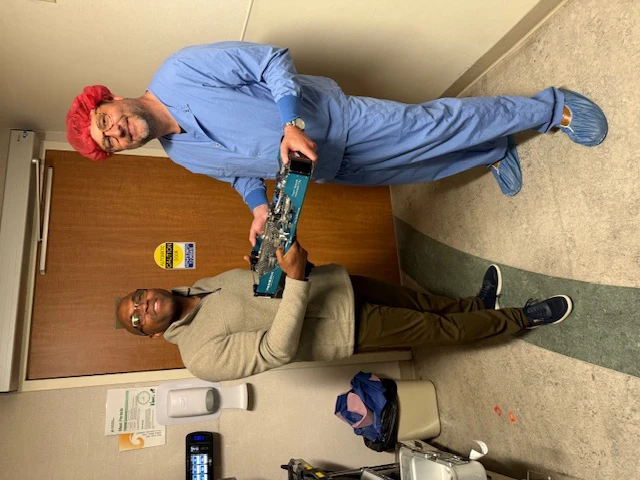 Trius team members coordinating a medical equipment handoff in a healthcare facility